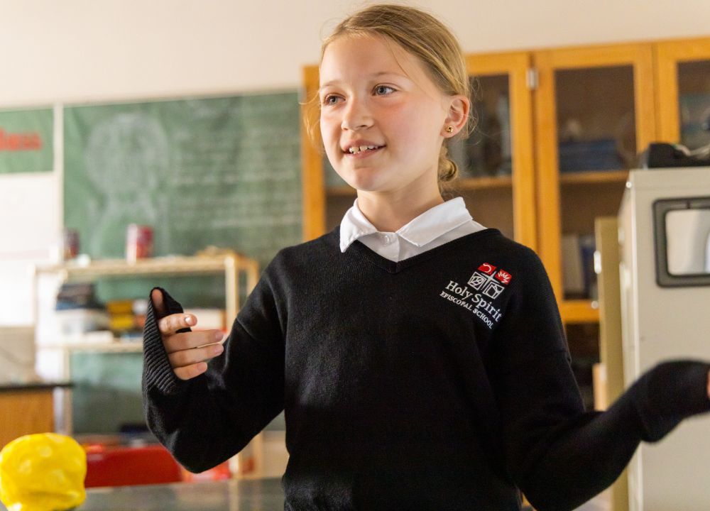 Student presenting in a classroom